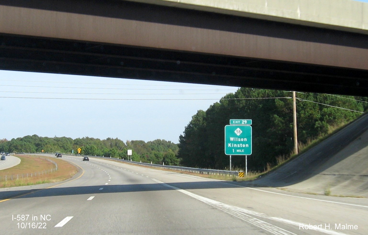 Image of 1 mile advance sign for NC 58 exit with new I-587 milepost exit number on I-587/US 264 East in Wilson, October 2022