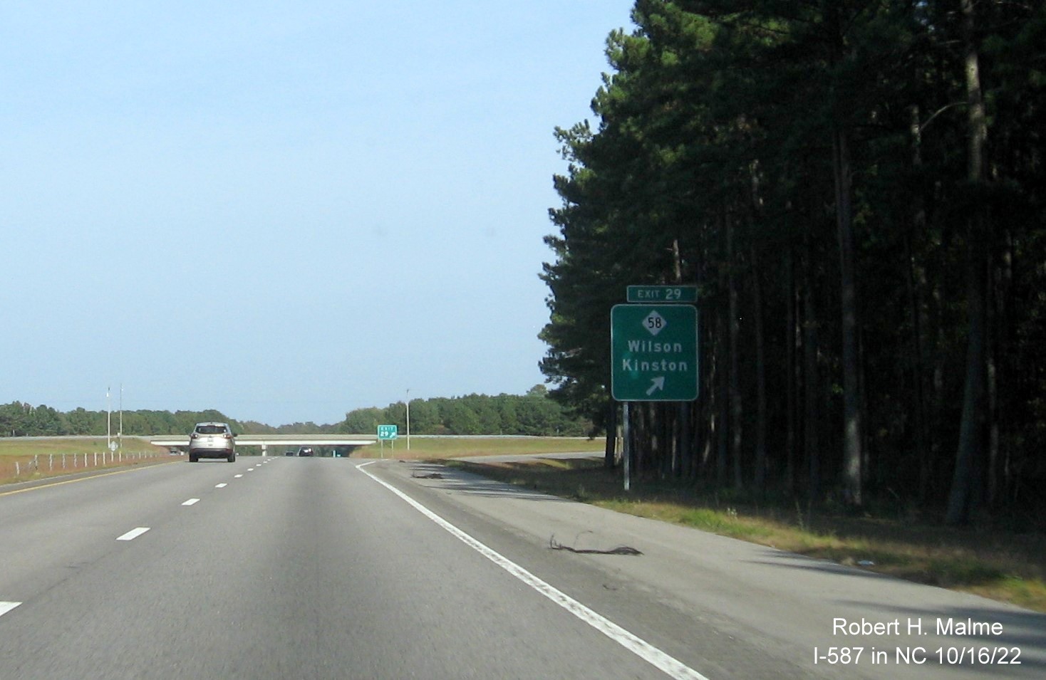 Image of ramp sign for NC 58 exit with new I-587 milepost exit number on I-587/US 264 East in Wilson, October 2022