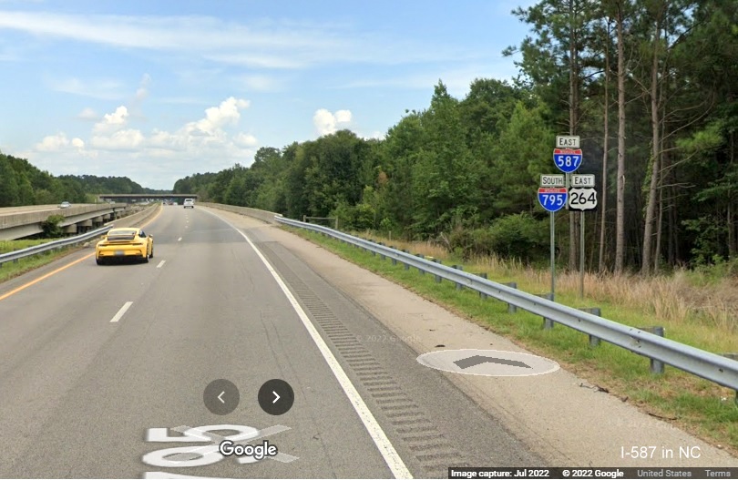 Image of sign assembly with I-587 and I-795 shields near Wilson, by Google Maps Street View, July 2022