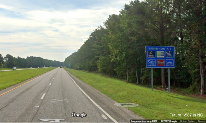 Image of ground mounted blue lodging services sign for US 264 Alt. East exit with new I-587 mile exit number on US 264 East in Sims, Google Maps Street View image, August 2022