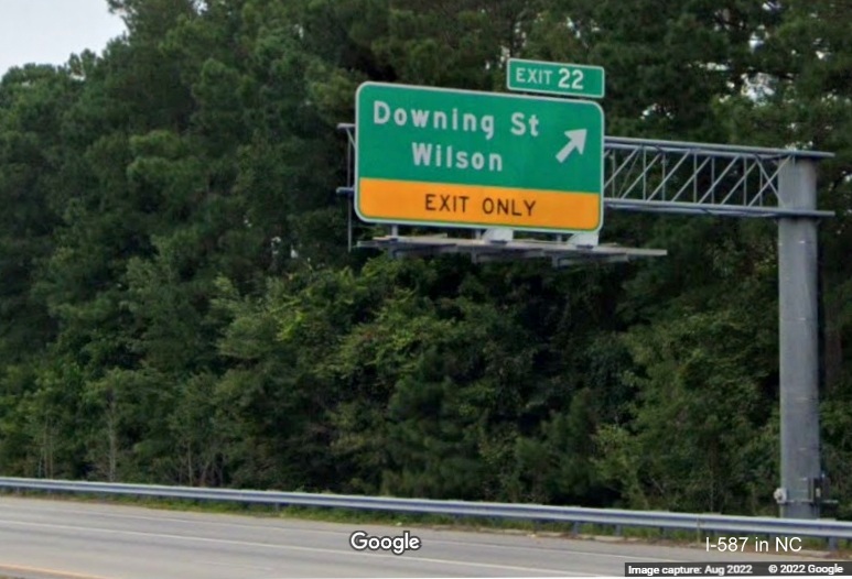 Image of overhead ramp sign for Downing Street exit with new I-587 exit number on I-587 West/I-795 North in Wilson, taken from opposite lanes, Google Maps Street View, August 2022