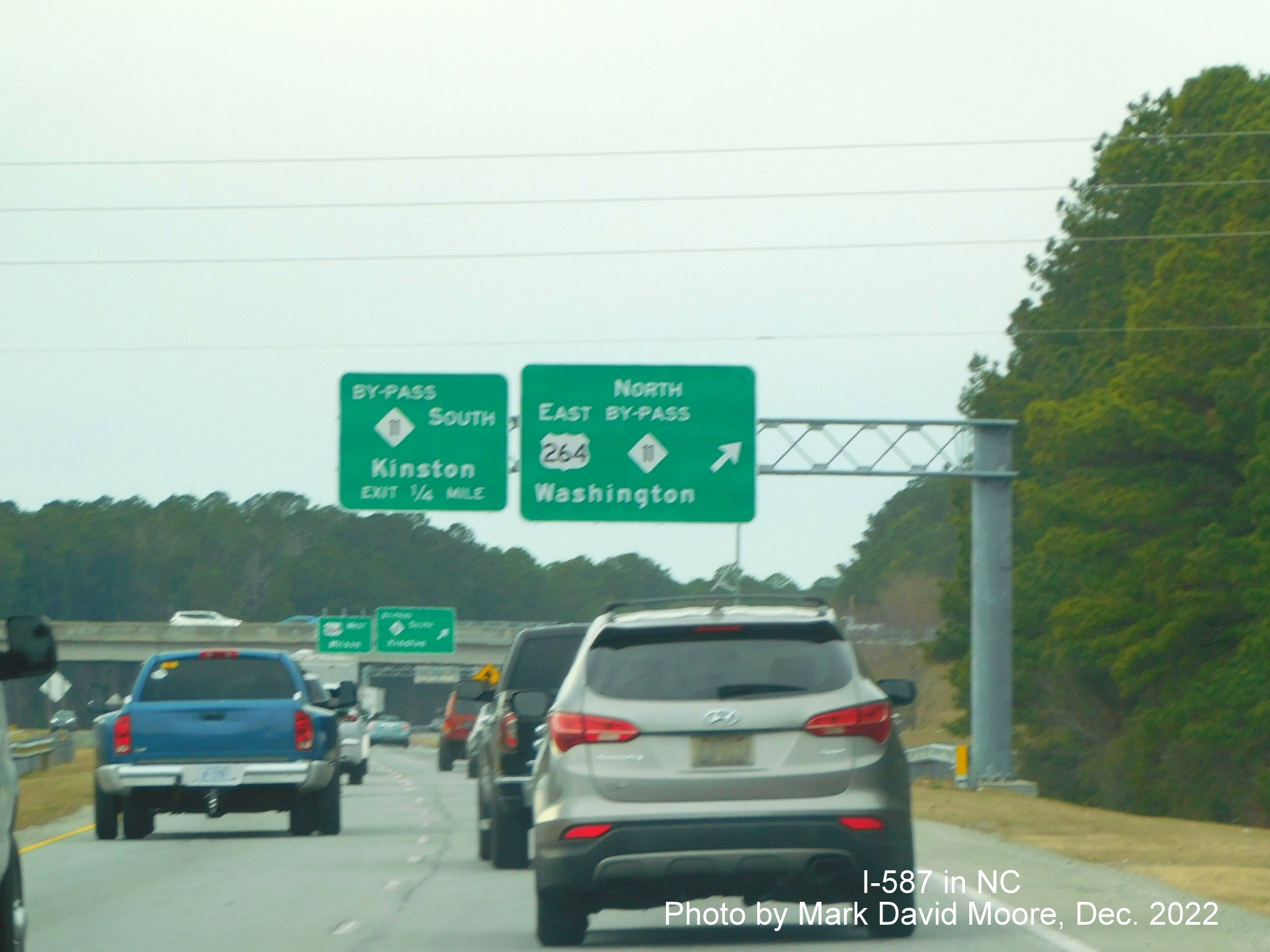 Image of overhead signage for US 264 West/NC 11 Bypass North in Greenville, photo by Mark David Moore, December 2022