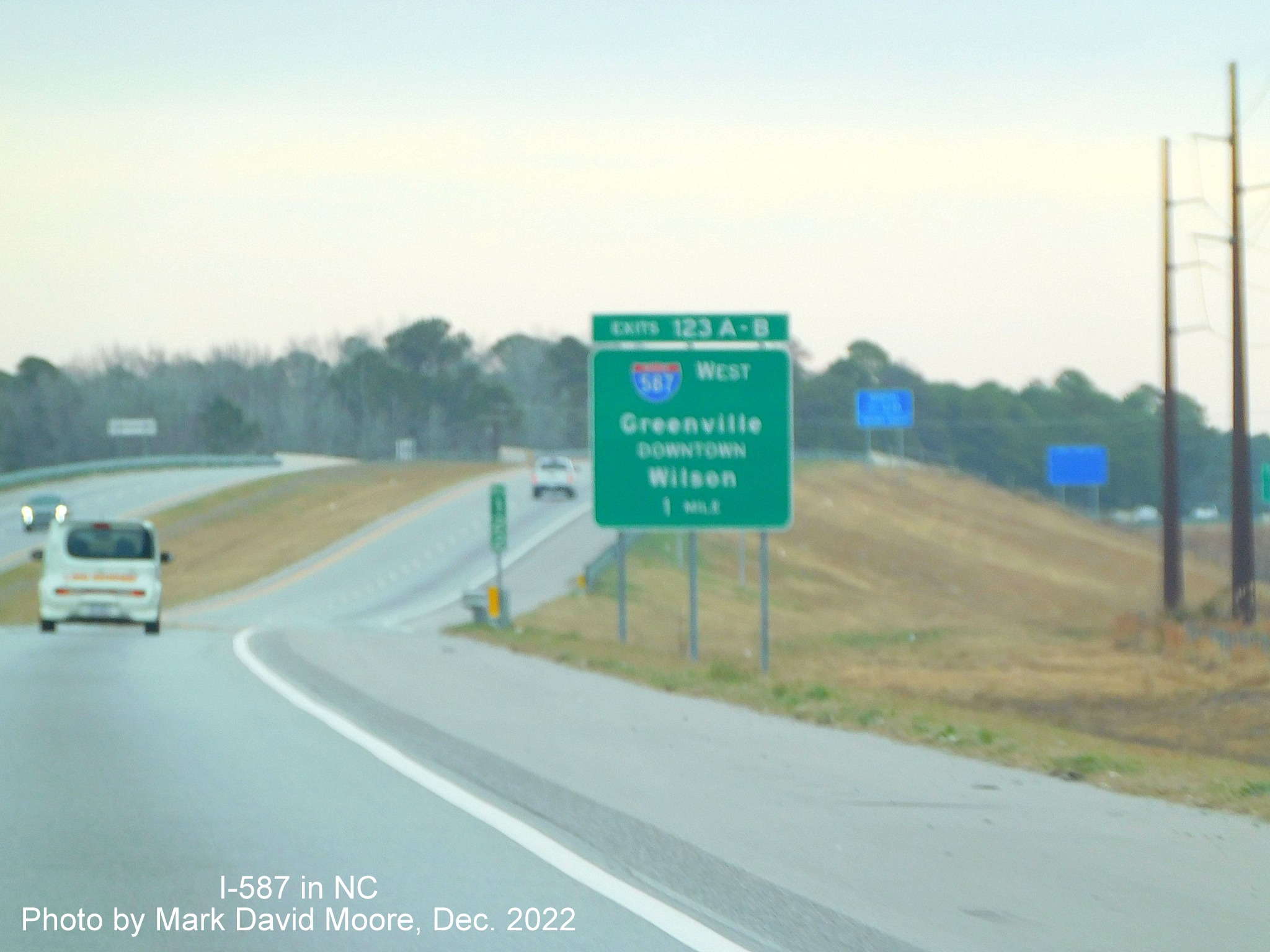 Image of ground mounted 1 mile advance sign for I-587 West exit on US 264 West/NC 11 Bypass North in Greenville, photo by Mark David Moore, December 2022