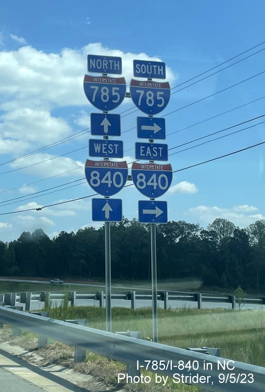 Image of trailblazers at ramp from Huffine Mill Road to Greensboro Urban Loop with recent addition of I-840 shields to existing I-785 shields, by Strider, September 2023