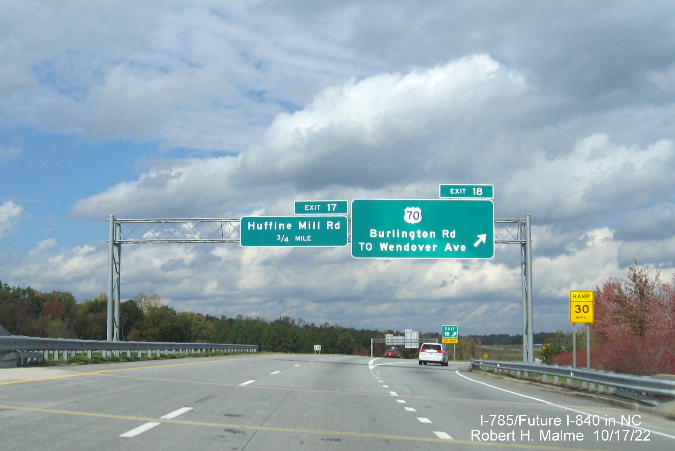 Image of overhead signage at ramp for US 70/Burlington Road exit on I-795 North/Future I-840 West, Greensboro 
                  Urban Loop, October 2022