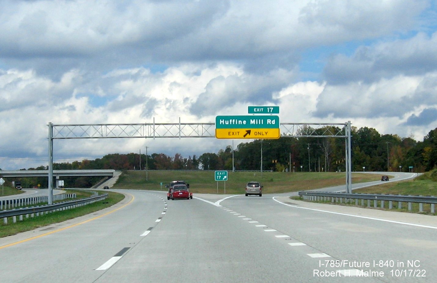 Image of overhead ramp sign for Huffine Mill Road exit on I-785 North/Future I-840 West, Greensboro 
                  Urban Loop, October 2022