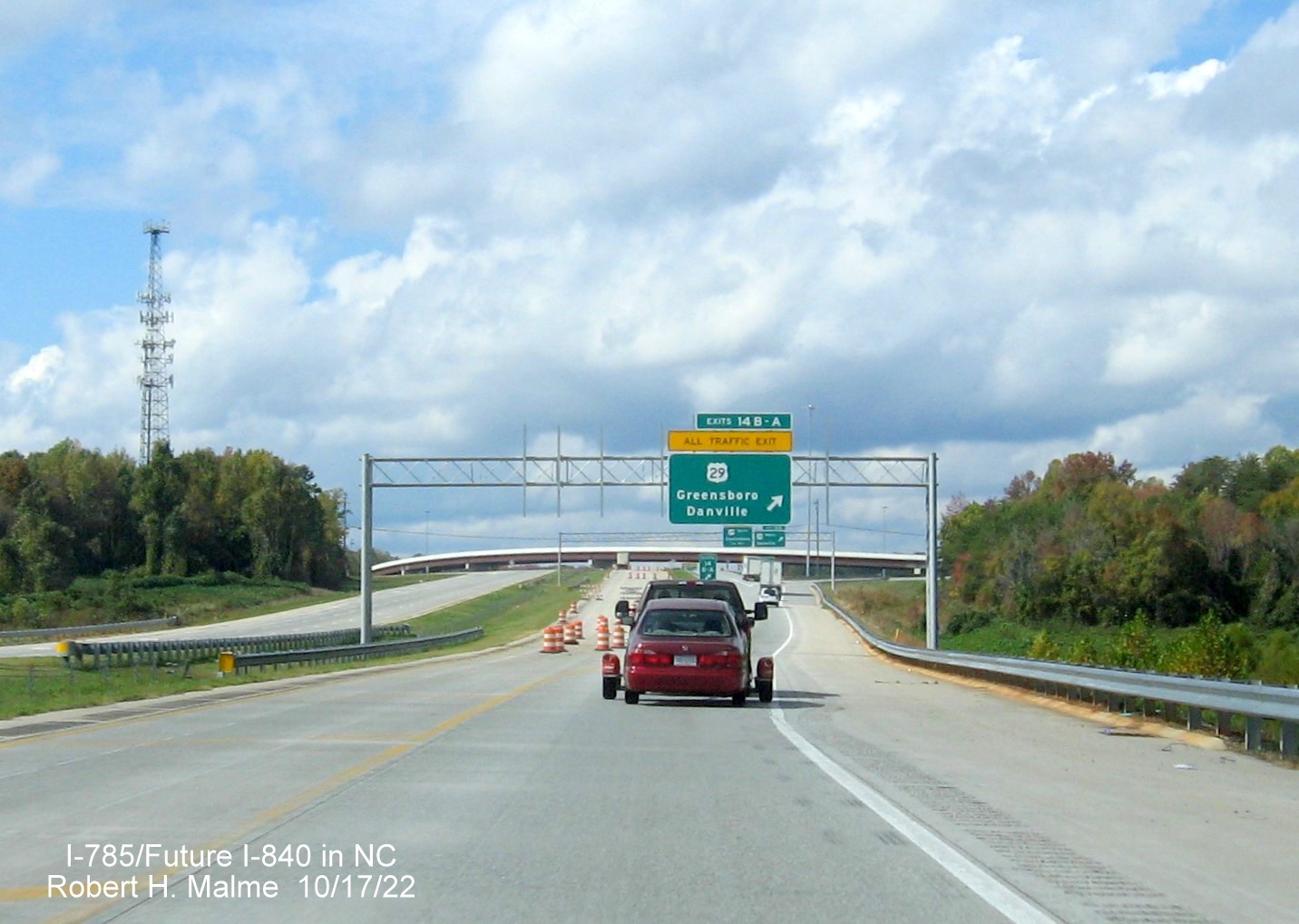 Image of overhead C/D ramp sign for US 29 (Future I-785 North) exit on Greensboro 
                  Urban Loop, October 2022