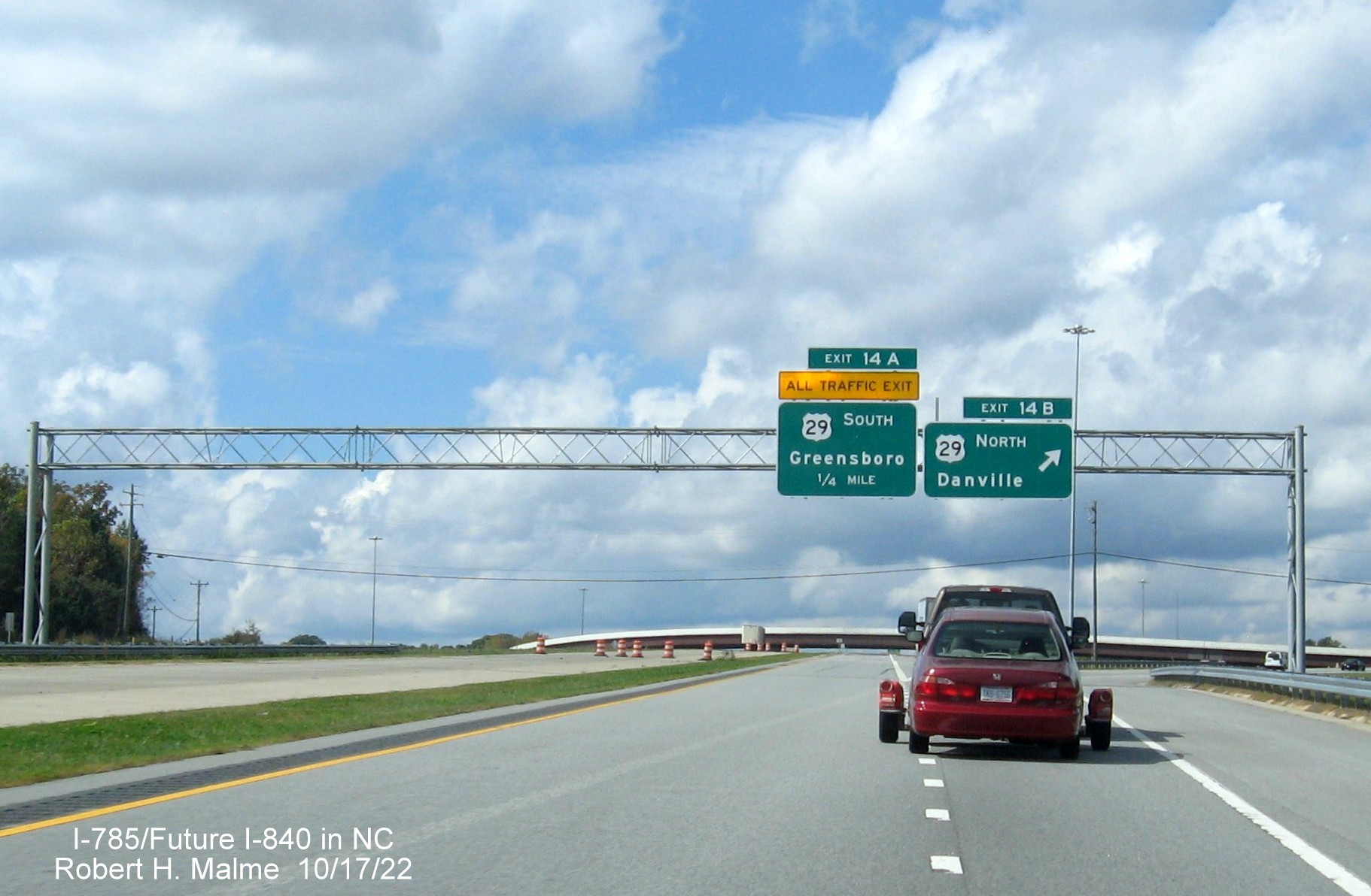 Image of overhead signage for US 29 exits on C/D ramp at current end of Eastern Section of Greensboro 
                  Urban Loop, October 2022
