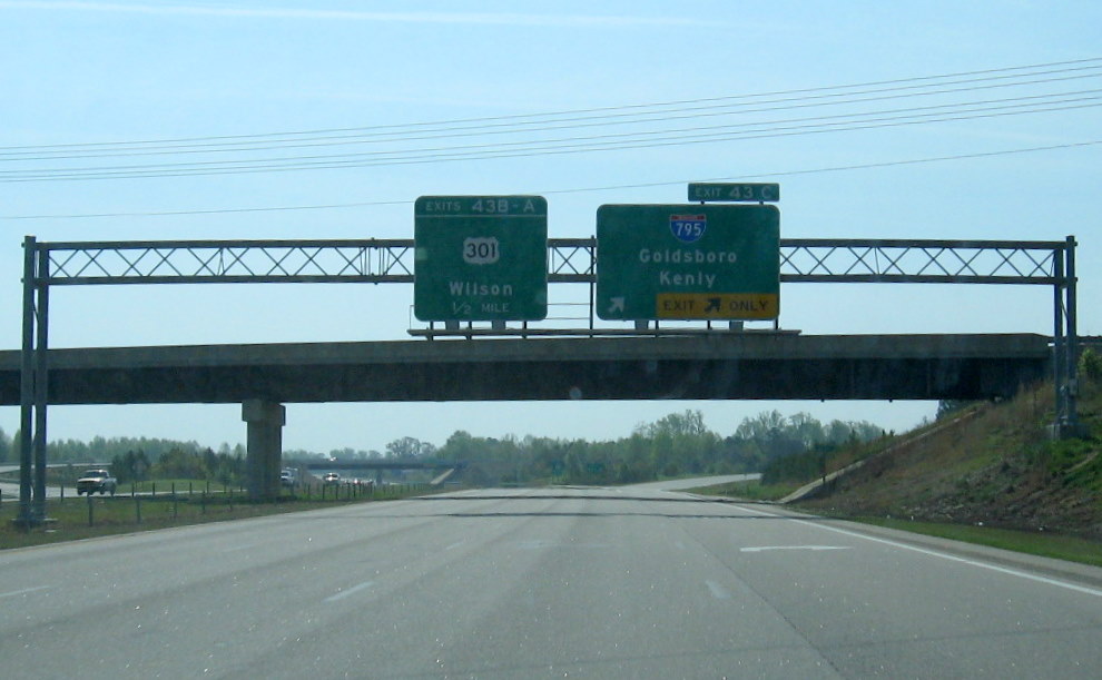 Final overhead sign for I-795 on US 264 East which replaced simple ground-mounted 
trailblazer sign in March 2010