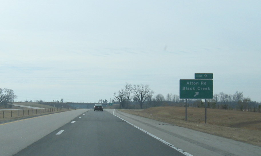 Photo of Alton Road exit signage off of I-795 South showing new Exit number, 
Jan. 2010