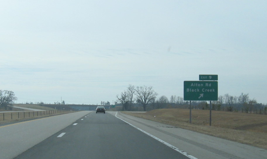 Photo of Alton Road exit signage off of I-795 South showing new Exit number, 
Jan. 2010