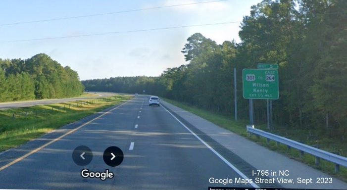 Image of supports for new sign with I-587 shield on I-795 North in Wilson, Google Maps Street View, September 2023