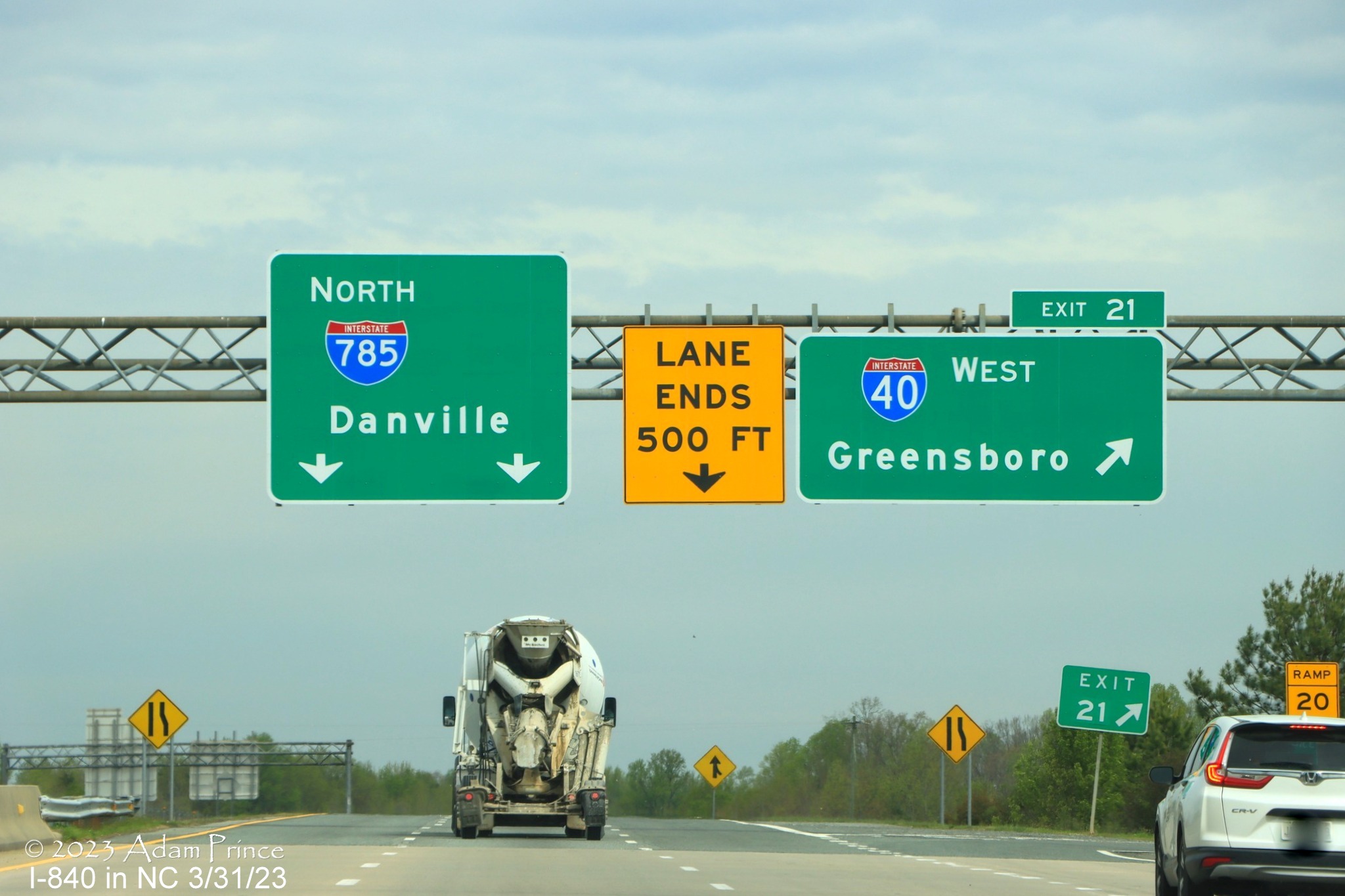 Image of overhead sign for northern section of Greensboro Loop on ramp from I-85 North still missing 
            I-840 shield, Adam Prince,  March 2023