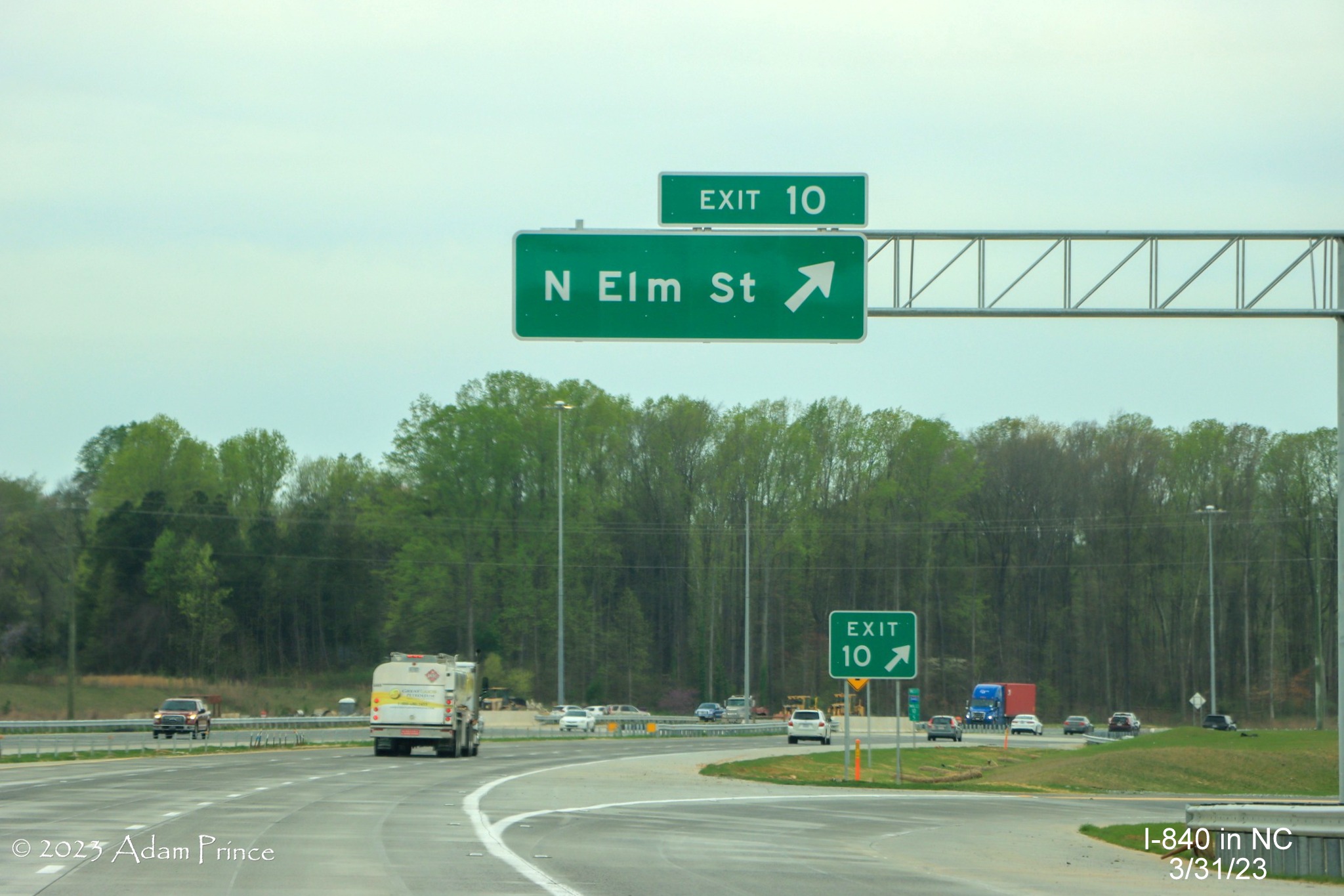 Image of overhead ramp sign for North Elm Street exit on I-840 West newest section of Greensboro 
             Loop, Adam Prince,  March 2023