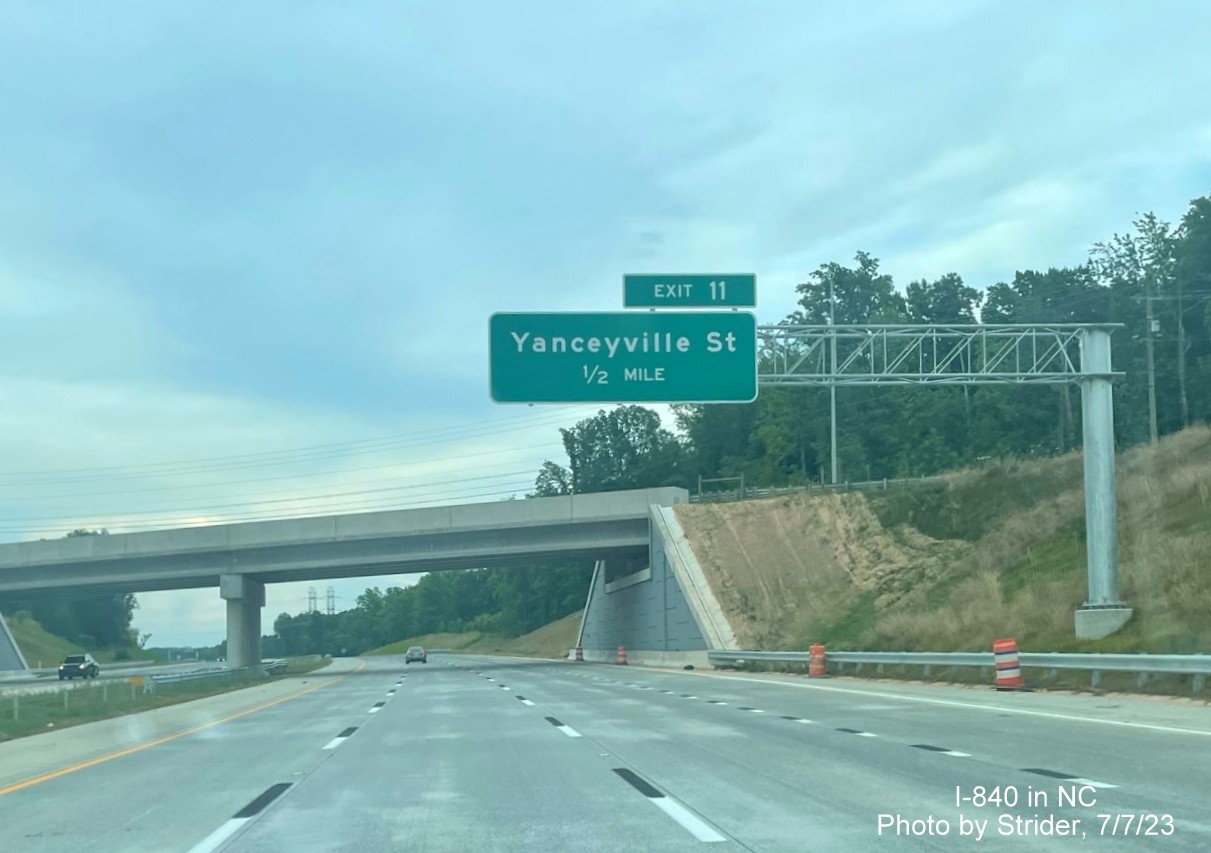 Image of newly placed 1/2 mile advance sign for Yanceyville Street exit on I-840 East, photo by Strider, July 2023