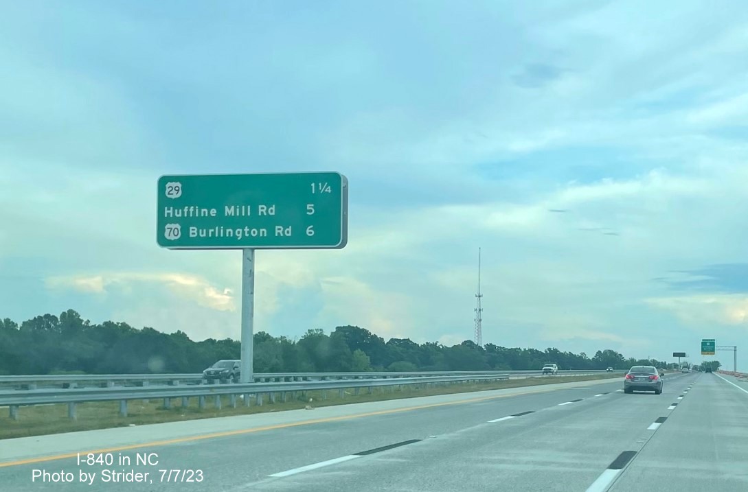 Image of newly placed median post-interchange distance sign along I-840 East beyond the Yanceyville Street exit, photo by Strider, July 2023