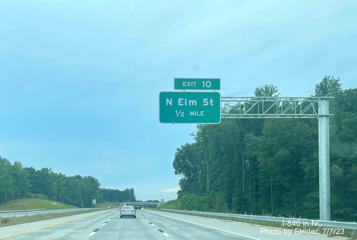Image of newly placed 1/2 mile advance overhead sign for Yanceyville Street exit on I-840/Greensboro 
         Loop West, photo by Strider, July 2023