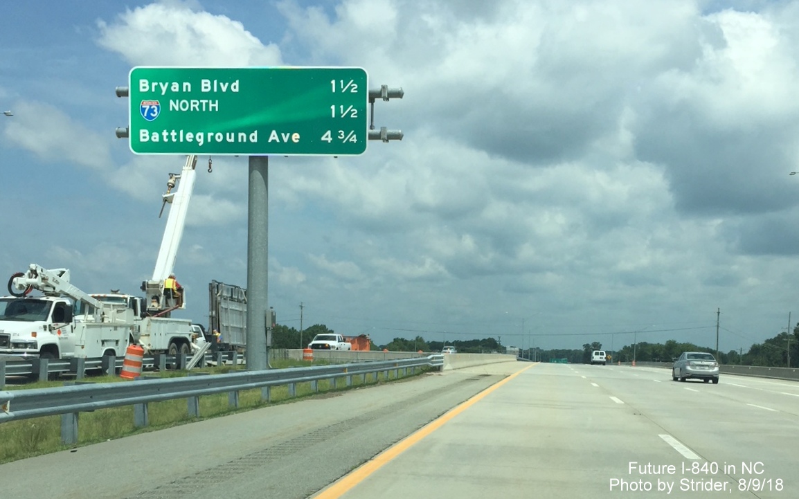Image of new overhead distance sign being placed in the median along I-73 North/I-840 East/Greensboro Loop beyond the W. Friendly Ave exit, by Strider