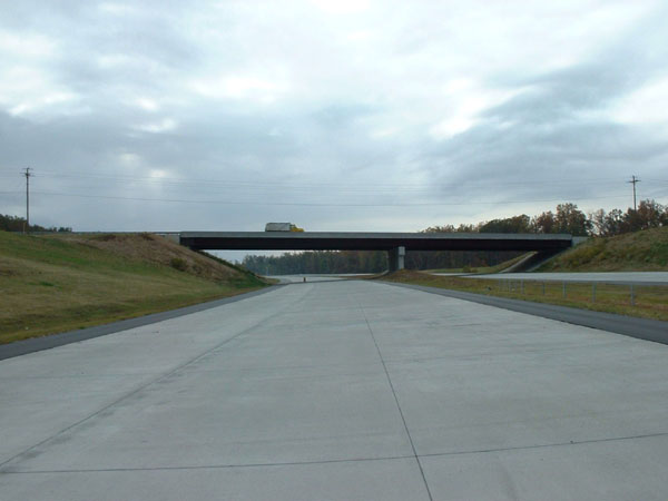 Image of unopened section of I-85 Greensboro Loop near Alamance Church Rd exit in 2003, by Adam Prince