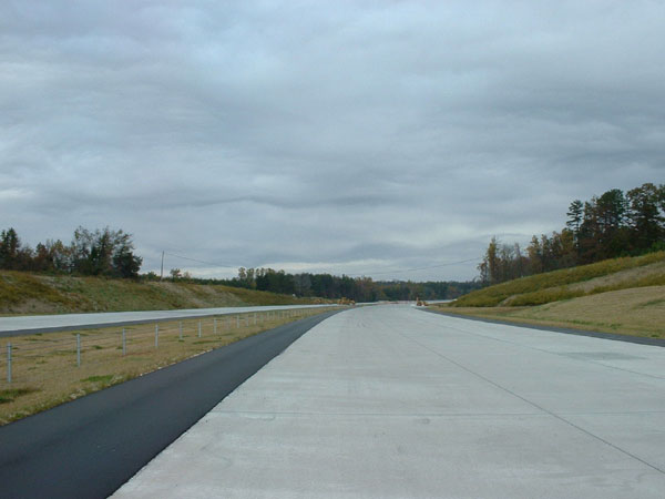 Image taken looking south along unopened I-85 Greensboro Loop near Alamance Church Rd exit in 2003, by Adam Prince