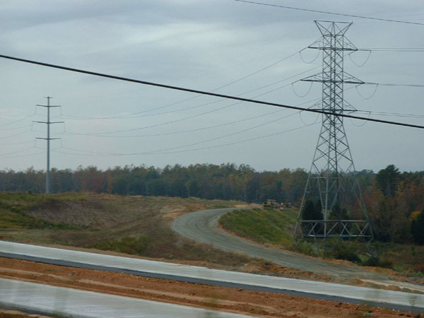 Image of view over unopened I-85 Greensboro Loop roadway at Future US 421 interchange in 2003, by Adam Prince