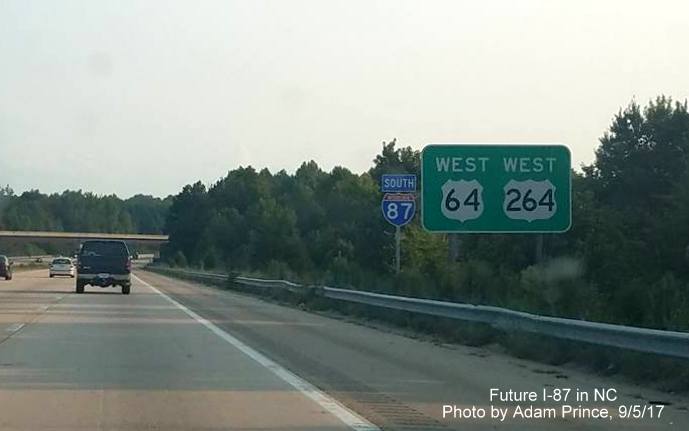 Image taken of newly placed South I-87 reassurance marker next to existing West US 64/264 guide sign on Knightdale Bypass in Wake County, by Adam Prince