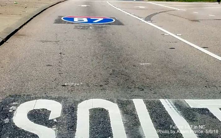 Image of new I-87 shield placed on Smithfield Rd pavement before Knightdale Bypass interchange, by Adam Prince