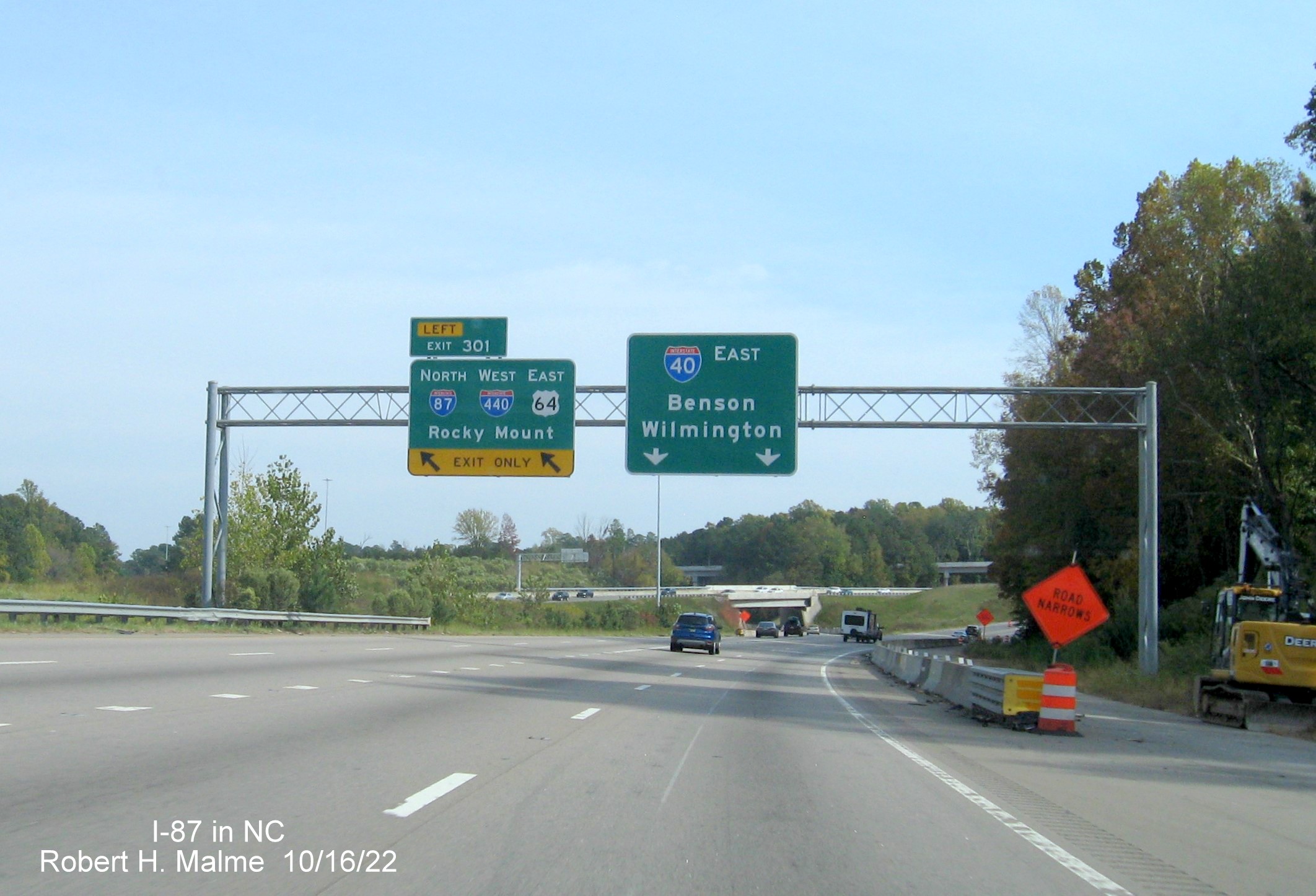 Image of overhead ramp sign for I-87 North/I-440 West/US 64 East on I-40/US 64 East 
                                        in Raleigh, October 2022