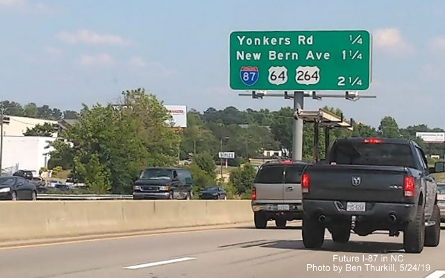 Image of new I-87 shield over old I-495 one on I-440 West prior to Yonkers Road exit in Raleigh, photo by Ben Thurkill
