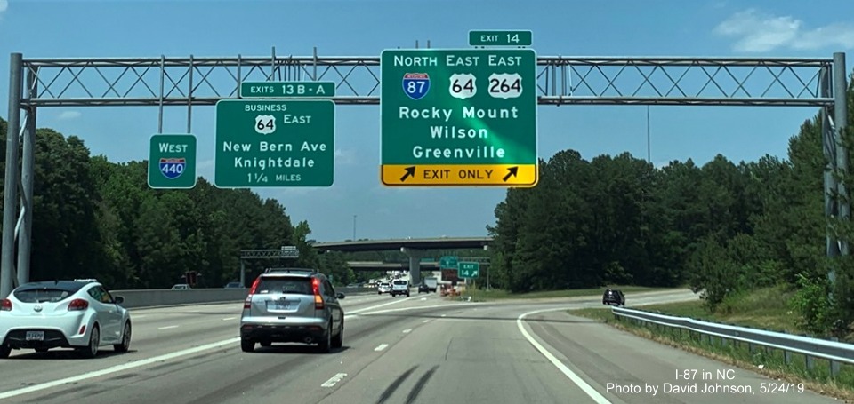 Image of overhead ramp sign with new I-87 shield for Knightdake Bypass exit on I-87 North/I-440 West in Raleigh, by David Johnson
