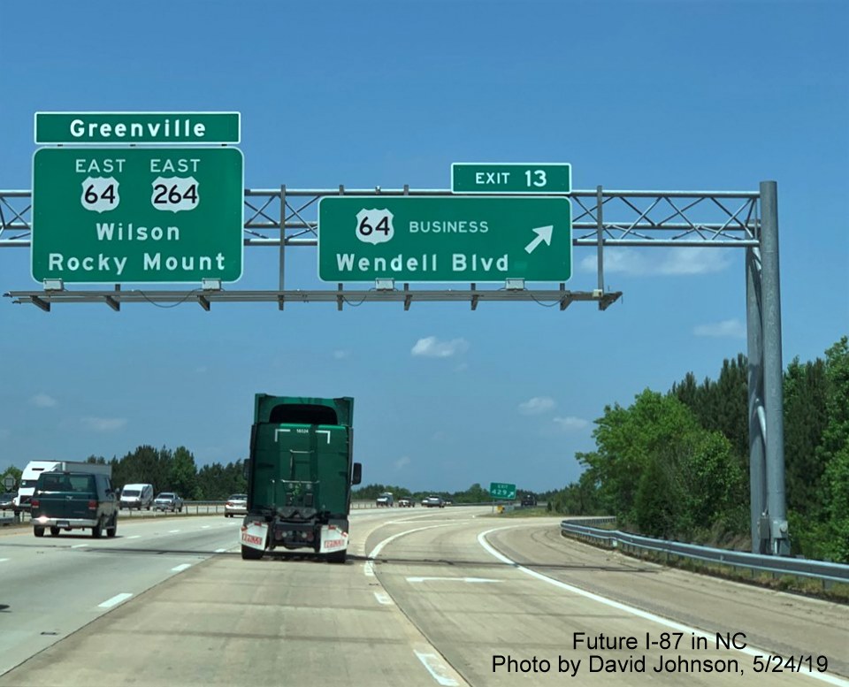 Image of overhead signs with I-87 exit number tab for US 64 exit on I-87 North, US 64/264 East in Wendell, by David Johnson