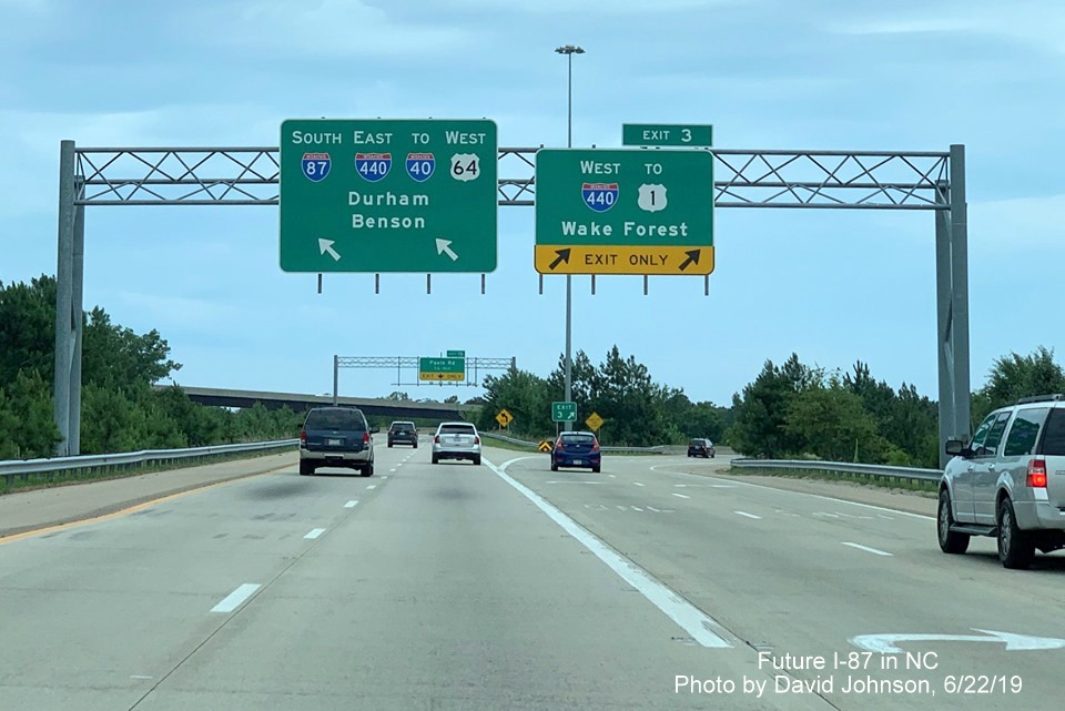 Image of overhead signage at ramp to I-440 West with new I-87 exit number on I-87 South/US 64 West in Raleigh, by David Johnson