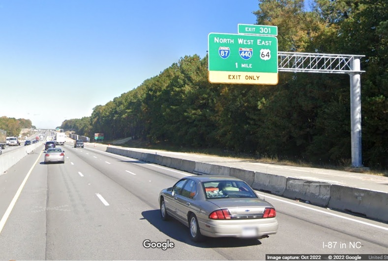Image of 1 mile advance overhead sign for I-87 North/I-440 West/US 64 East exit on I-40 West in Raleigh, Google Maps Street View, October 2022