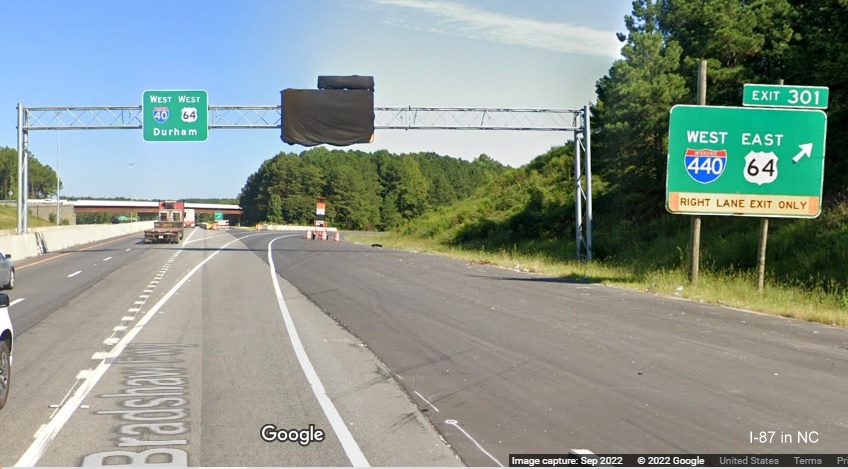 Image of covered over overhead ramp sign for I-87 North/I-440 West/US 64 East exit on I-40 West in Raleigh, Google Maps Street View, October 2022
