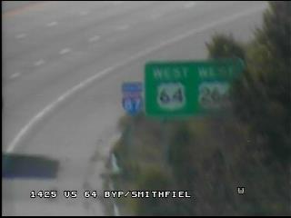 Image taken from NCDOT traffic camera showing new I-87 South reassurance marker up next to existing US 64/264 guide sign after Smithfield Rd exit on Knightdale Bypass
