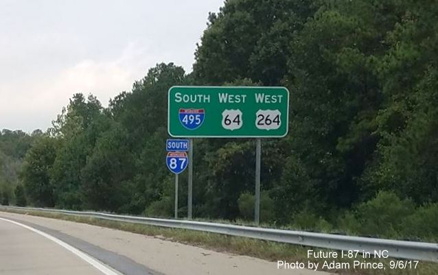 Image of new South I-87 reassurance marker next to existing I-495/US 64/US 264 sign, by Adam Prince