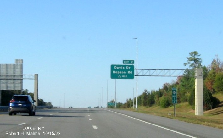 Image of mile marker and 1/2 mile advance overhead sign for Hopson Road/Davis Drive exit on NC 885 North/Triangle Expressway in Research Triangle Park, October 2022