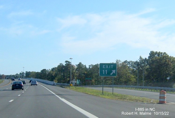 Image of gore sign with new I-885 exit number for Business US 70 West/NC 98 exit on I-885 South/US 70 East
         in Durham, October 2022