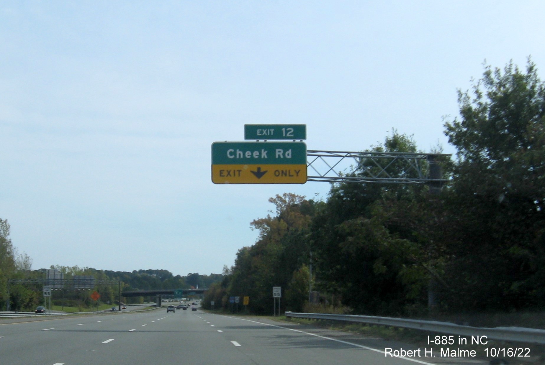 Image of 1/2 Mile advance overhead sign for Cheek Road exit with new I-885 exit number on I-885 South/US 70 East in Durham, October 2022