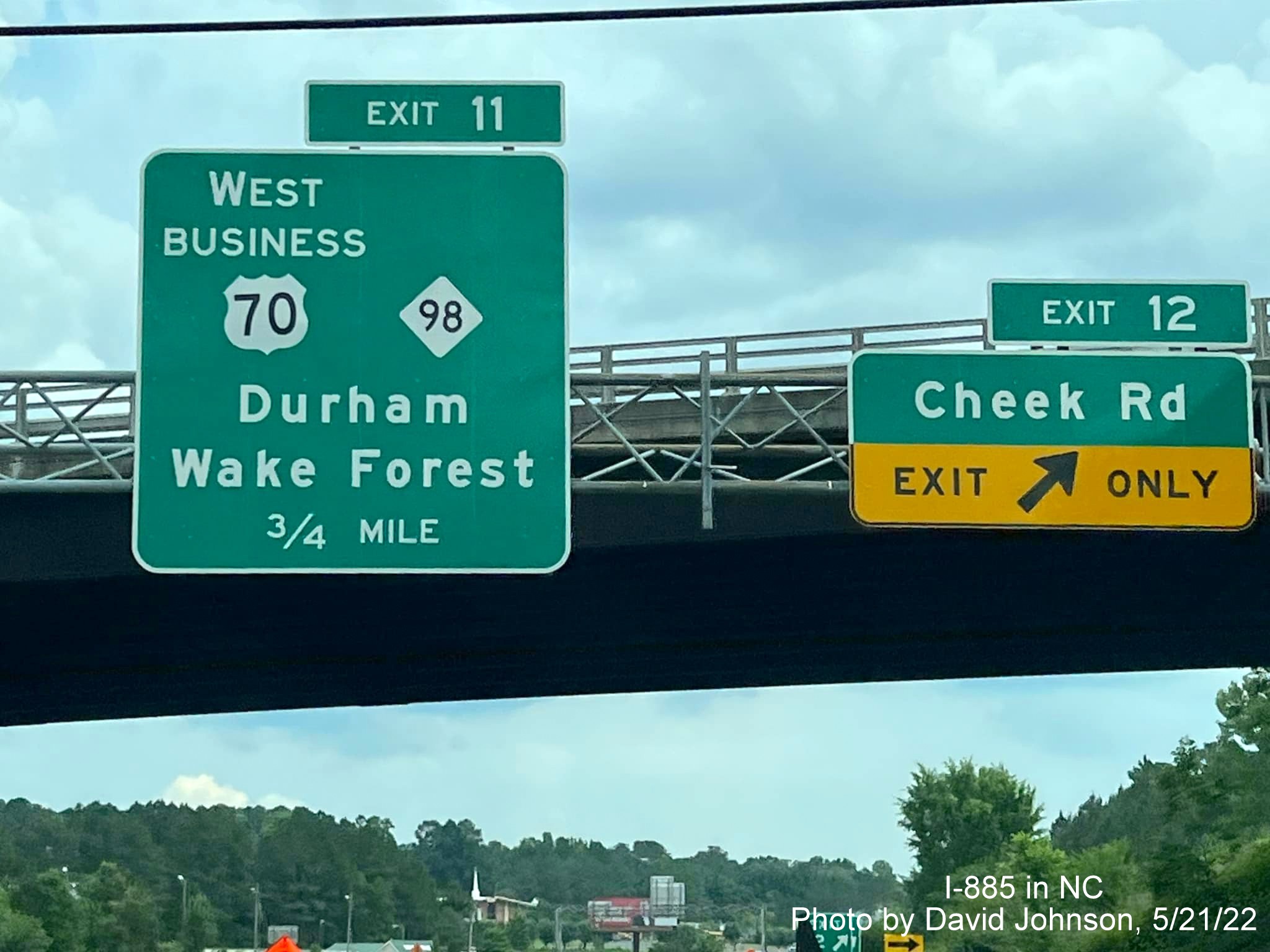 Image of new exit number tabs based on I-885 mileposts for Cheek Road and Business US 70/NC 98 exits on US 70 East
                                          (Future I-885 South) in Durham, by David Johnson, May 2022