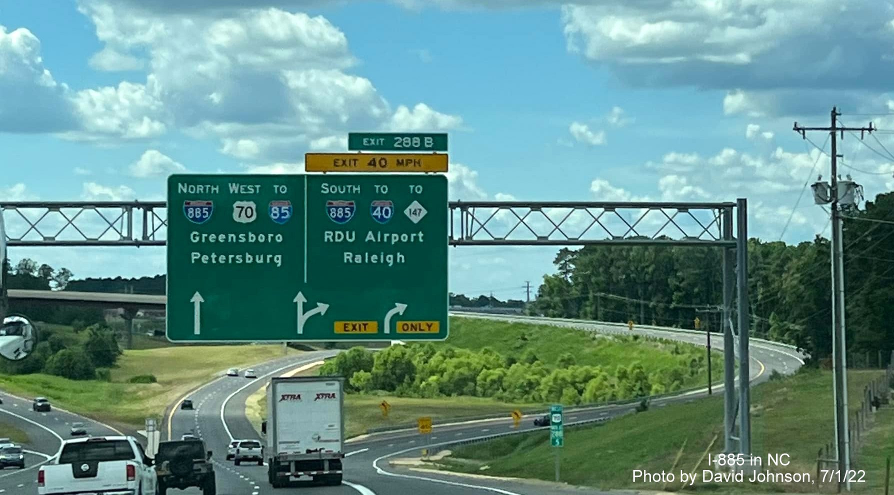 Image of uncovered arrow per lane overhead sign for newly opened I-885 East End Connector exit on US 70 West in Durham, by David Johnson July 2022