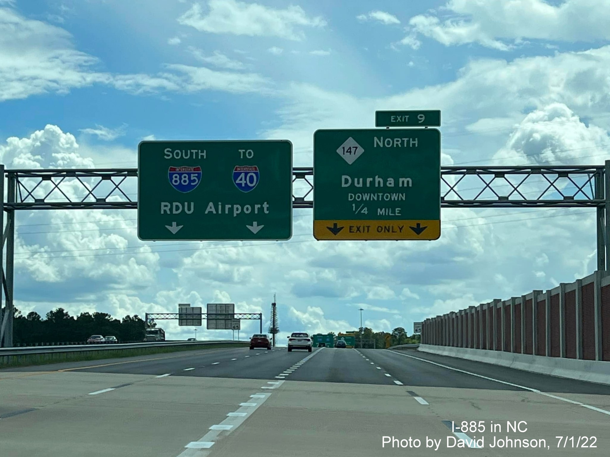 Image of overhead signs for upcoming NC 147 exit on East End Connector in Durham, by David Johnson July 2022
