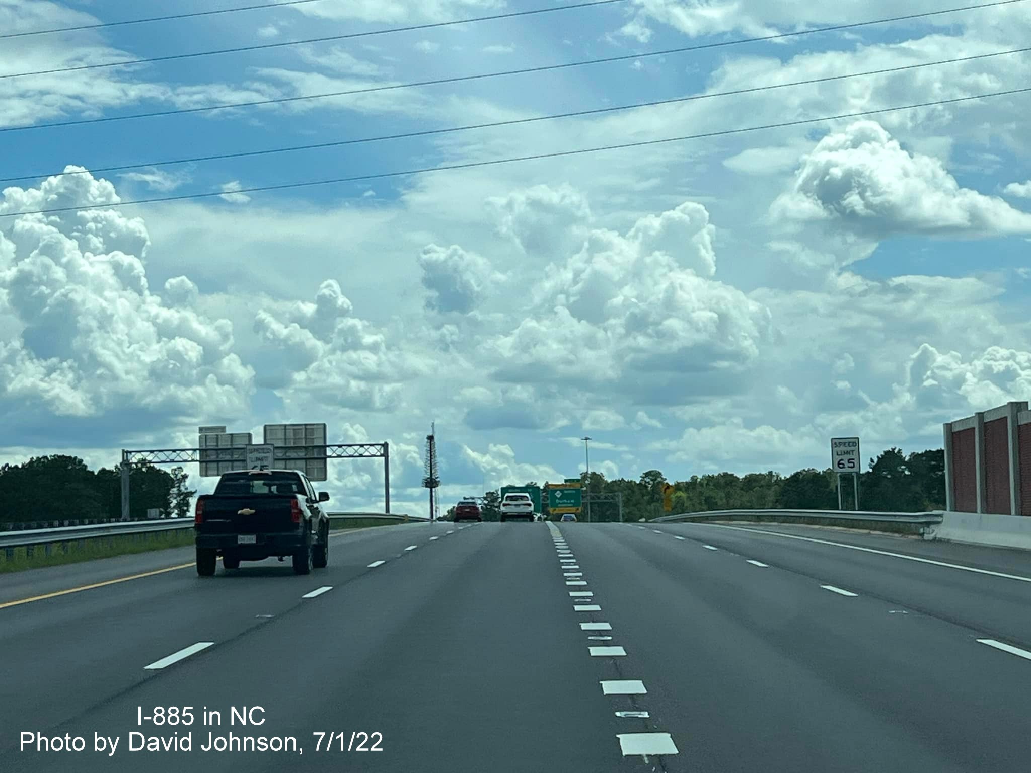 Image of 65 MPH signs on I-885 South/East End Connector in Durham, by David Johnson July 2022