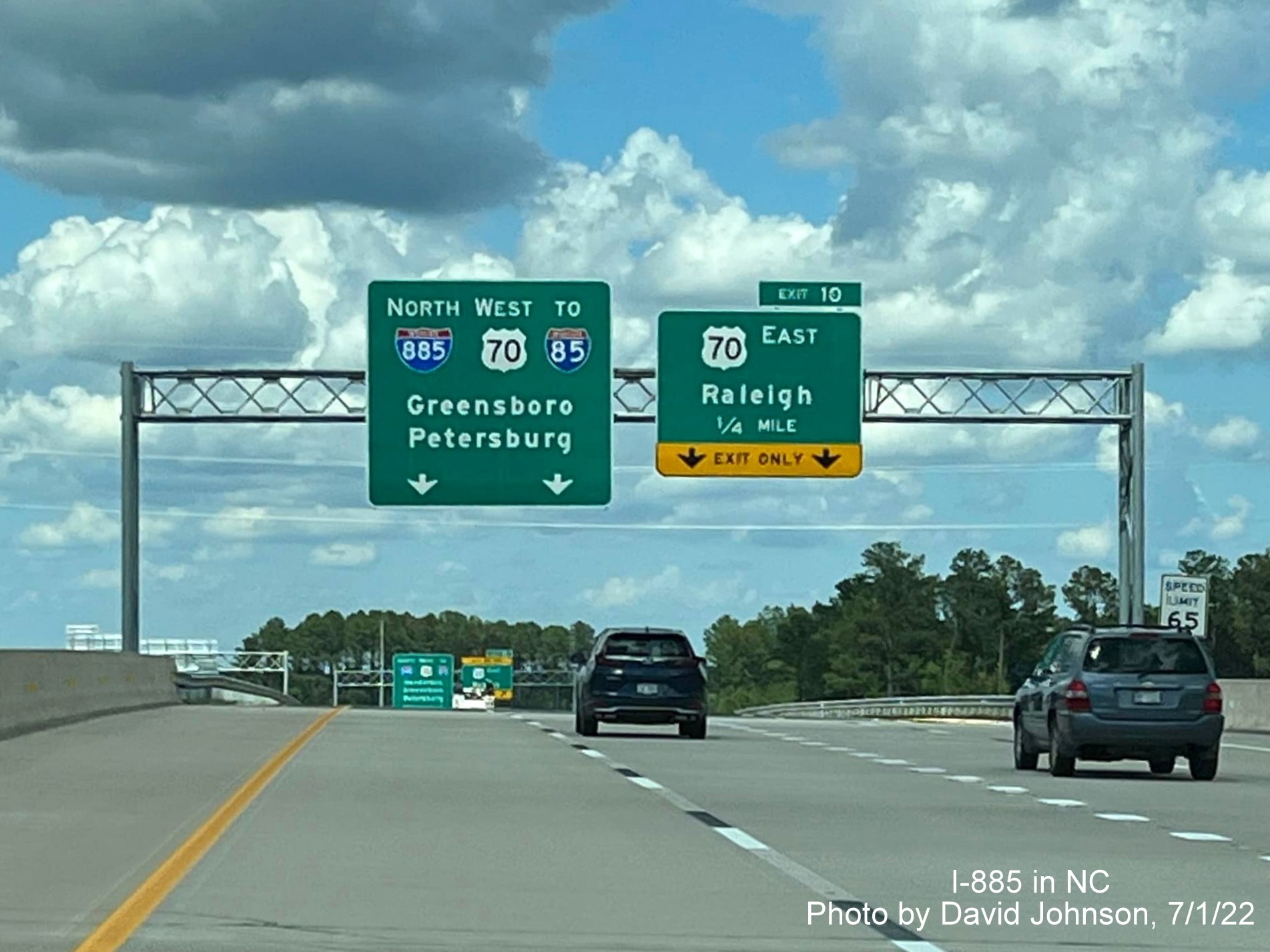 Image of overhead signage on I-885 North/East End Connector ramp approaching US 70 East exit, by David Johnson July 2022