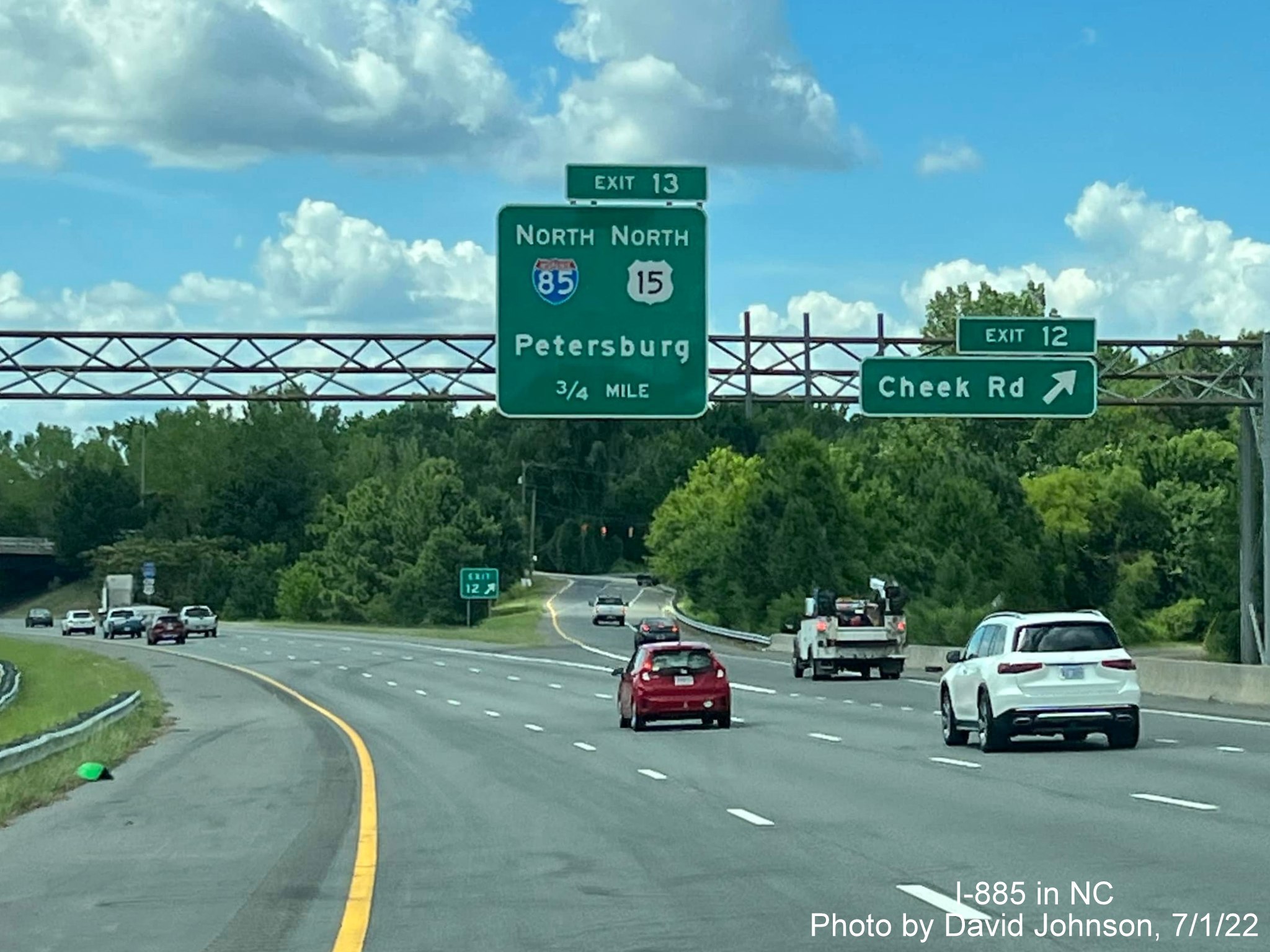 Image of overhead signage on I-885 North/US 70 West approaching Cheek Road exit ramp, by David Johnson July 2022