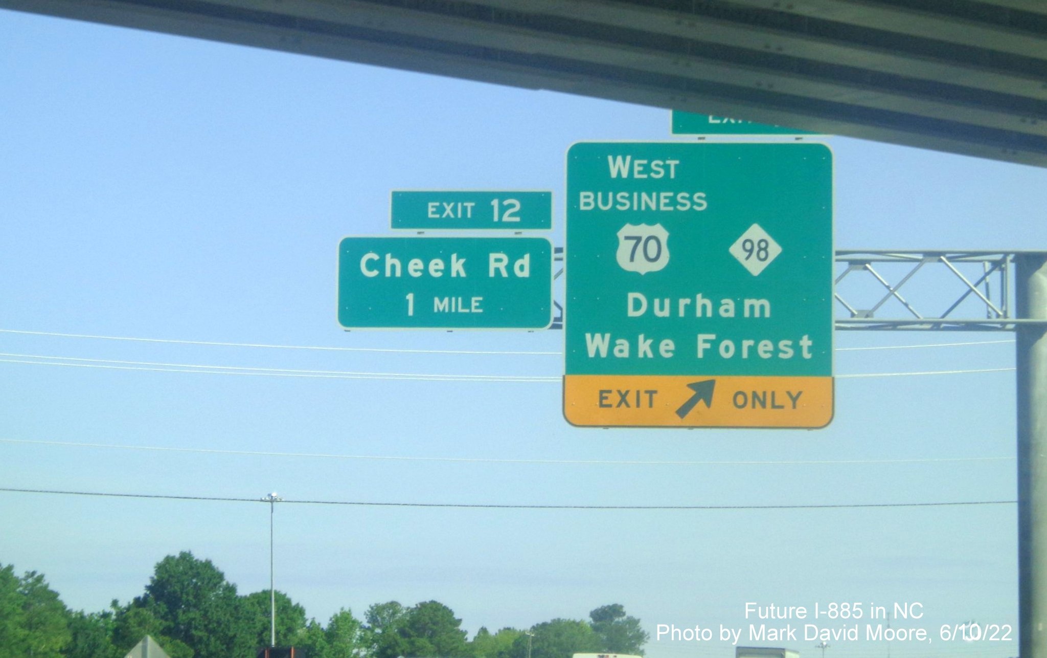 Image of 1 mile advance overhead sign for Cheek Road exit
        on Future I-885 North/US 70 West in Durham, by Mark David Moore June 2022