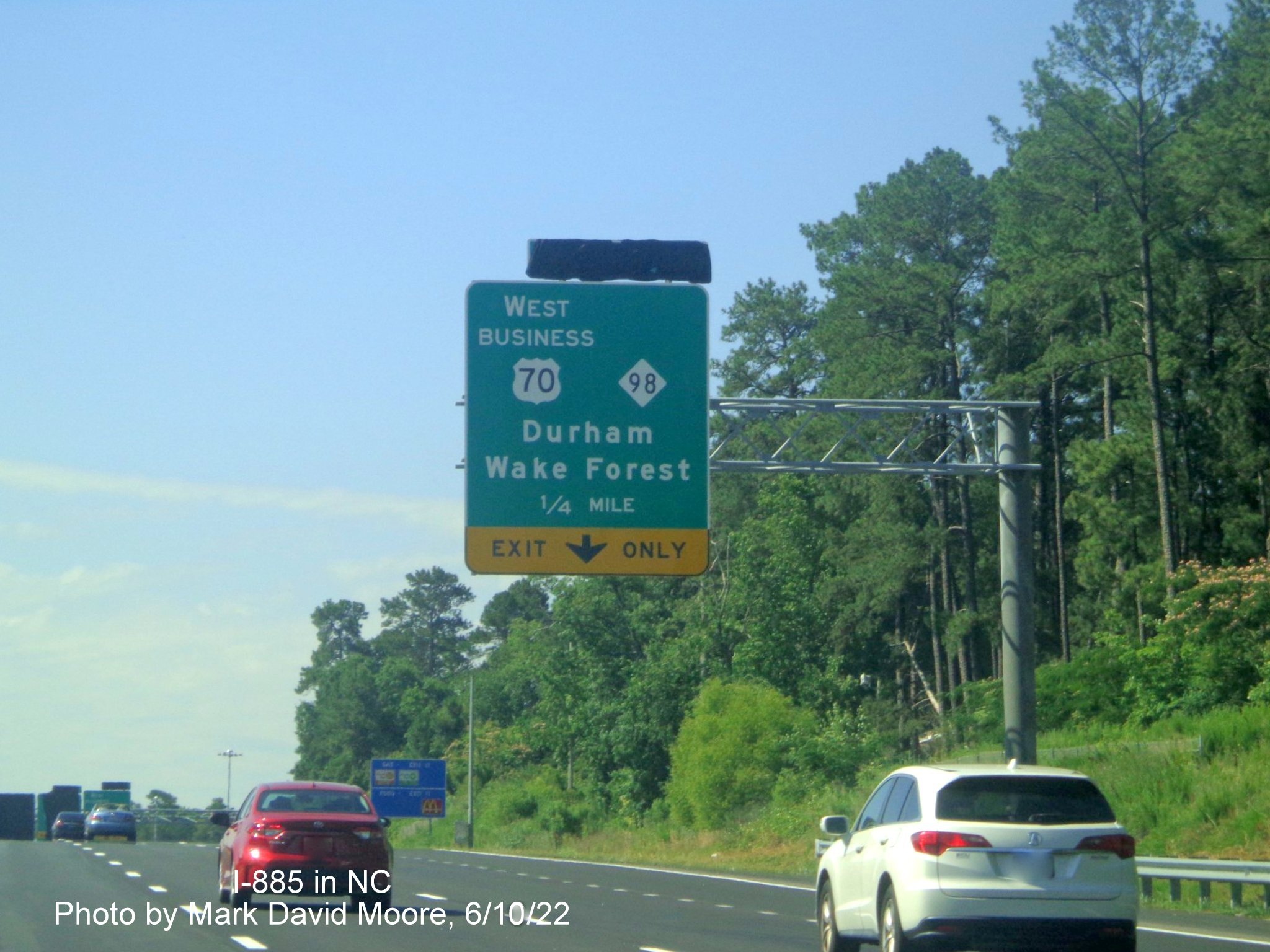 Image of 1/4 mile advance overhead sign for US 70 Bus. West/NC 98 exit
        still covered over on Future I-885 South/US 70 East in Durham, by Mark David Moore June 2022