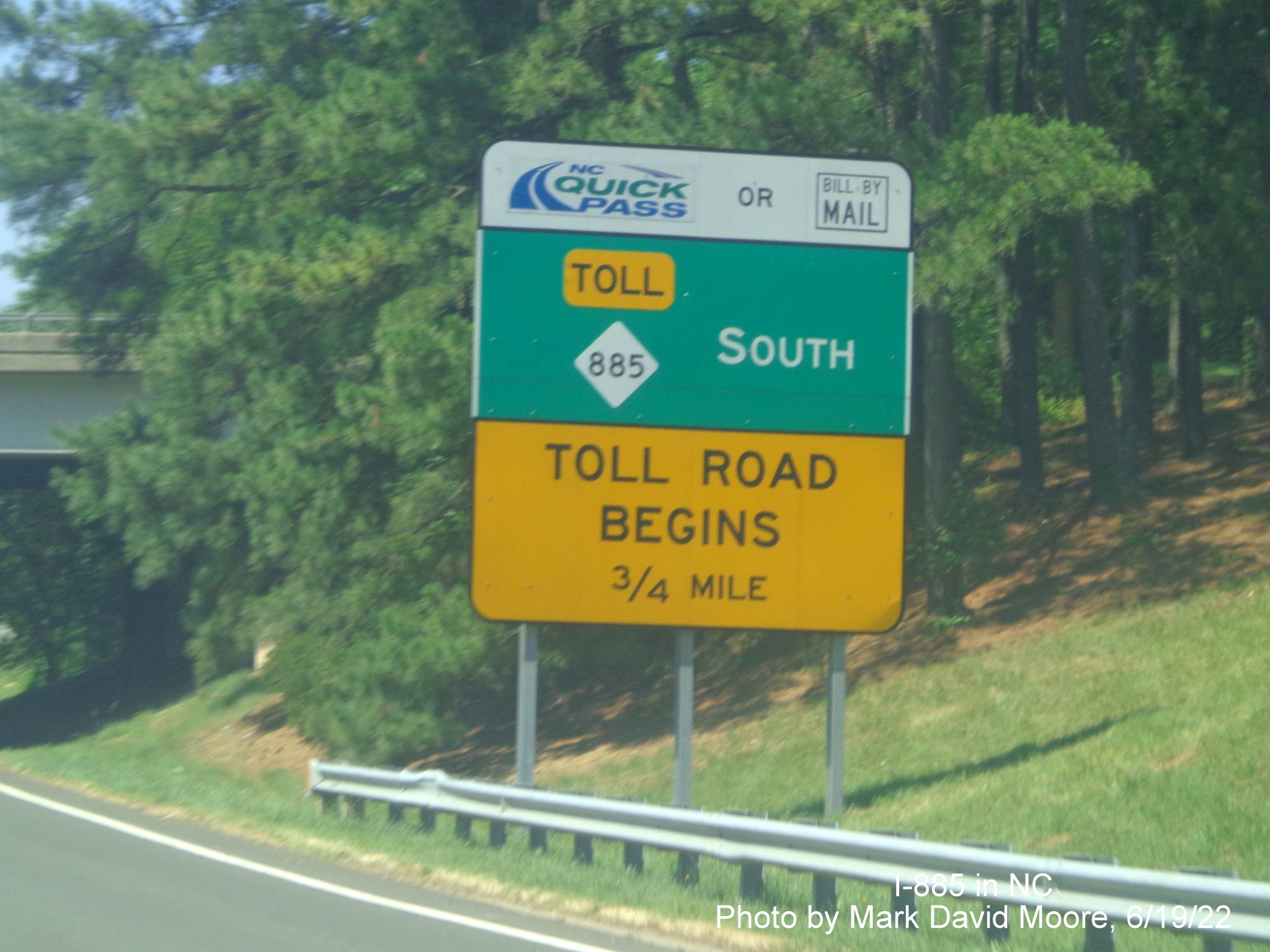 Image of Toll Road advisory sign with new NC 885 shield replacing NC 147
         on the Durham Freeway south at Alexander Drive, by Mark David Moore June 2022