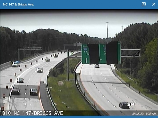 NCDOT camera image of NC 147 roadway with new overhead sign support northbound for Briggs Avenue exit, August 2020