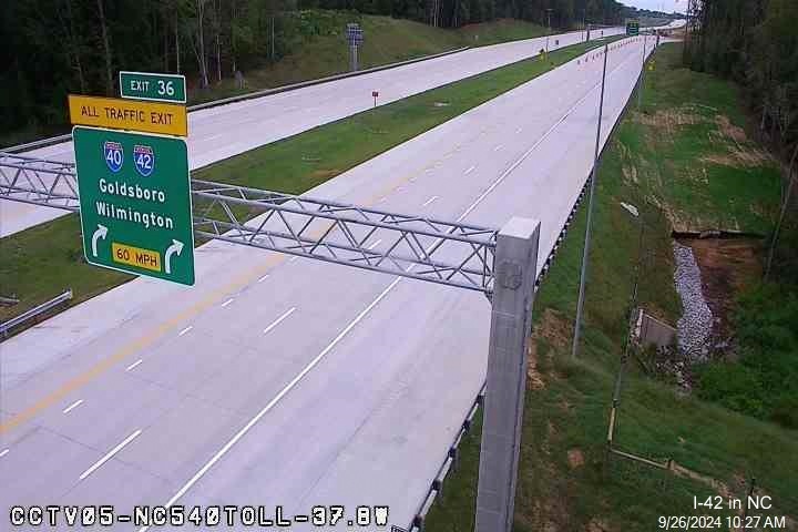 Traffic camera image of 1/4 mile advance sign for I-40/I-42 turbine interchange at current end of Toll NC 540 East, NCDOT, September 2024